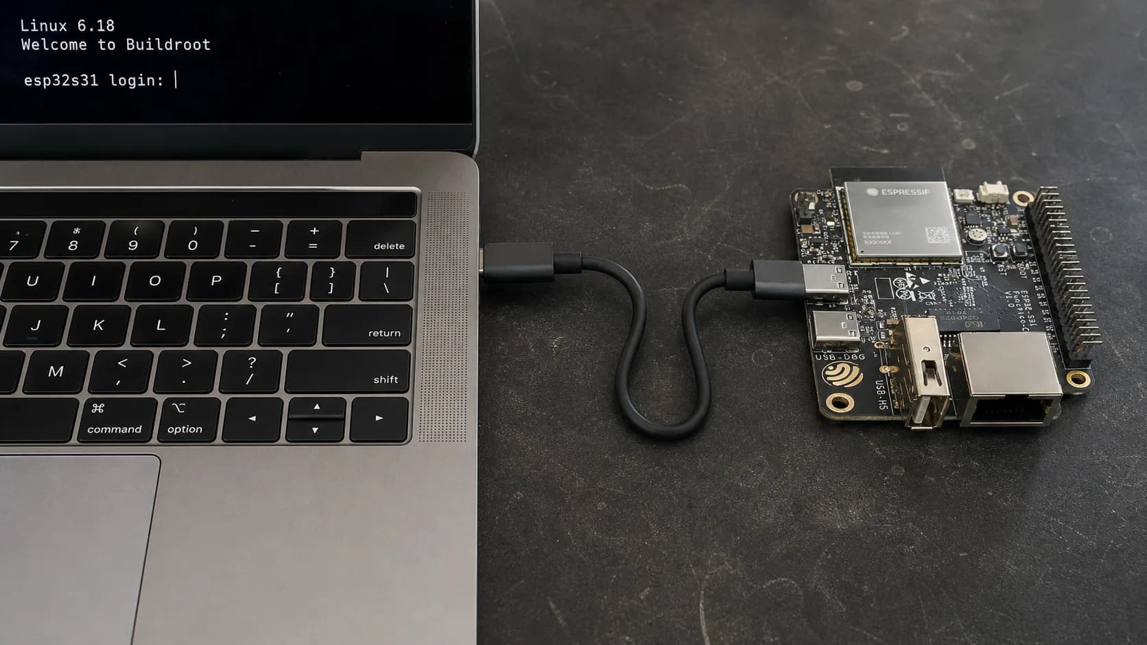 ESP32-S31 development board connected to a laptop displaying a minimal Linux serial console
