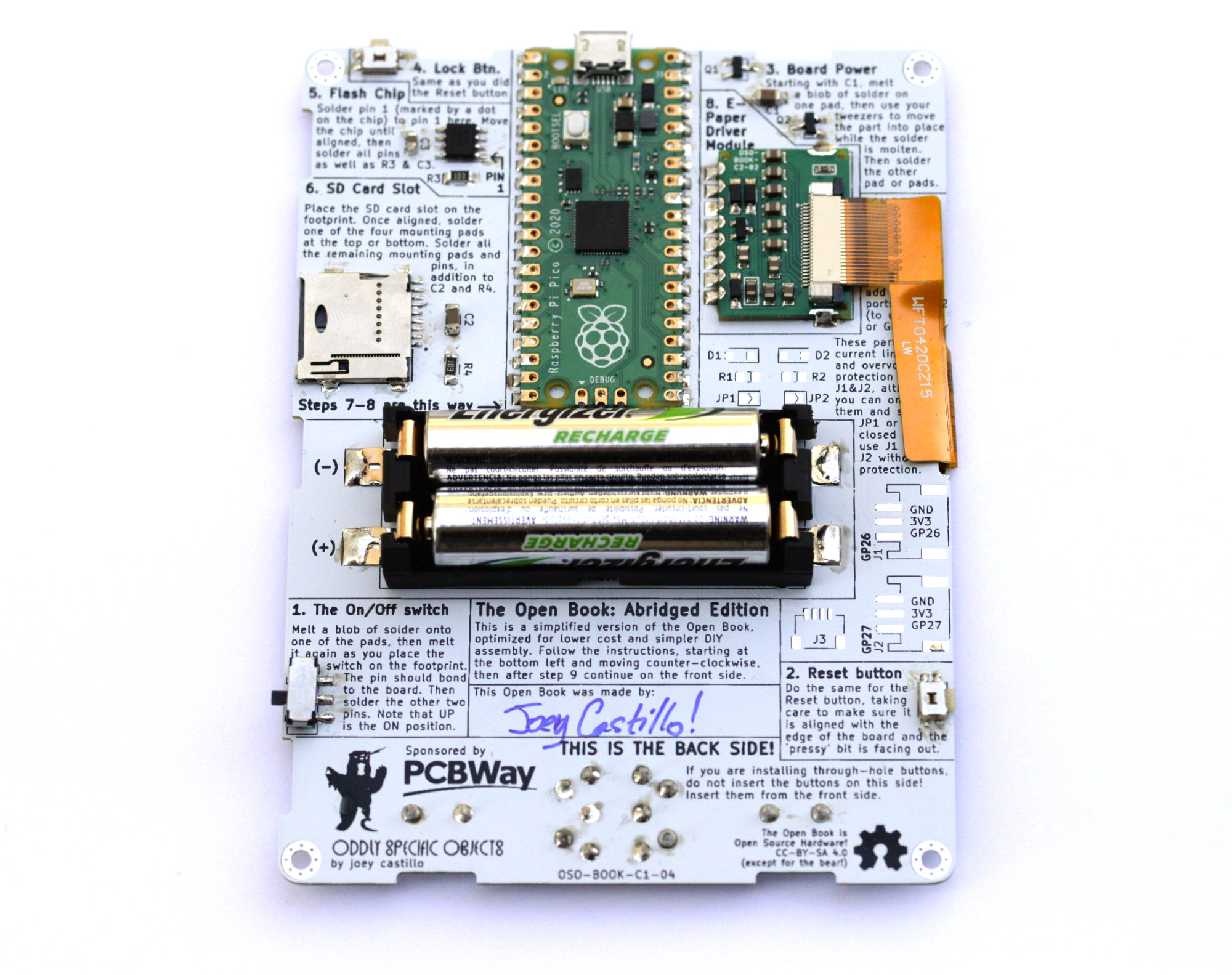 Assembled Open Book mainboard, back side, with assembly instructions silkscreened on the PCB