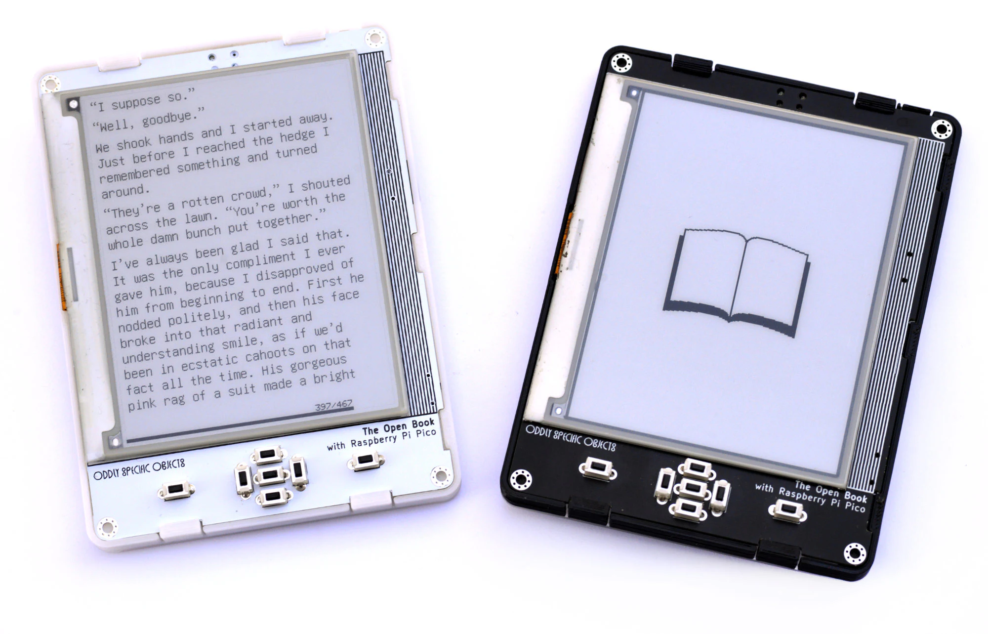 Two assembled Open Book e-readers, white and black cases, showing the e-paper display